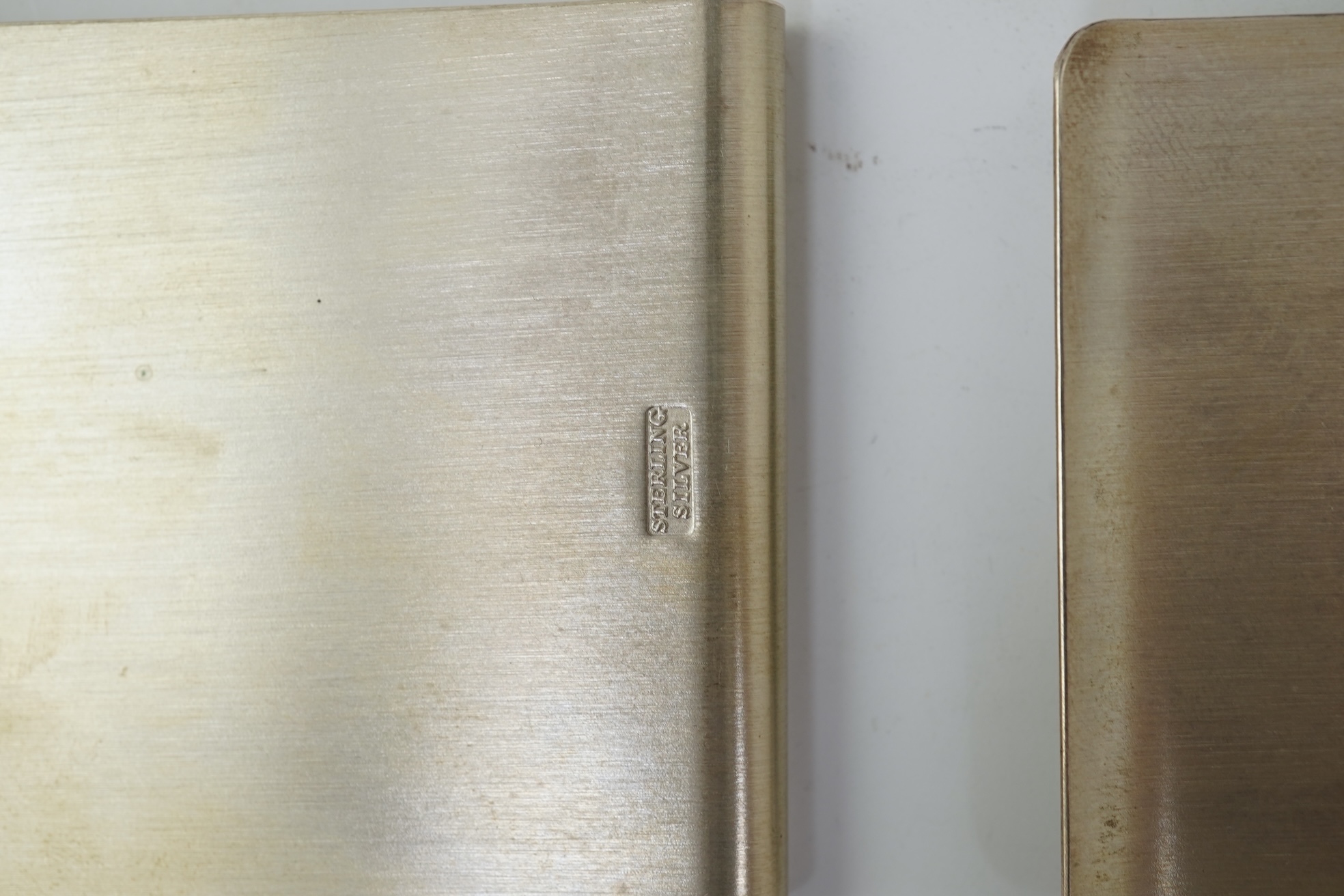 A pair of Elizabeth II silver money clips by Adrian Gerald Benney